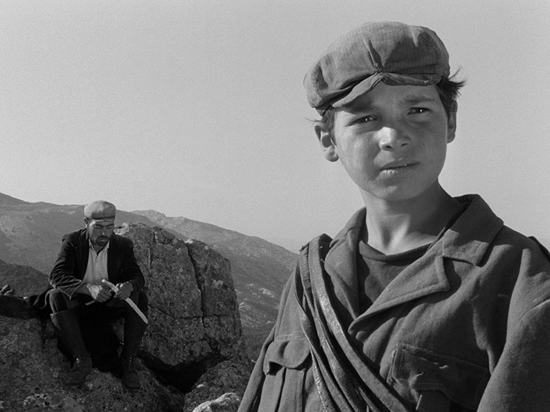 Micele and Peppeddu guarde their flock on a remote mountaintop plain