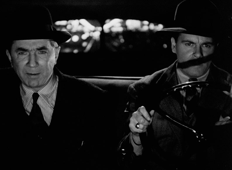 Marney and Miller drive across town in one of the film's most inescapably noir shots