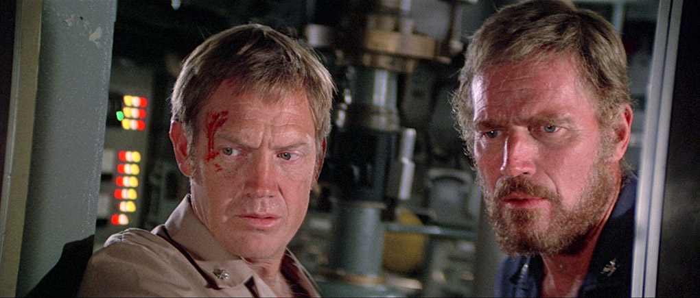 Ronny Cox as Samuelson and Charlton Heston as Blanchard keep an eye on the door that is starting to leak.