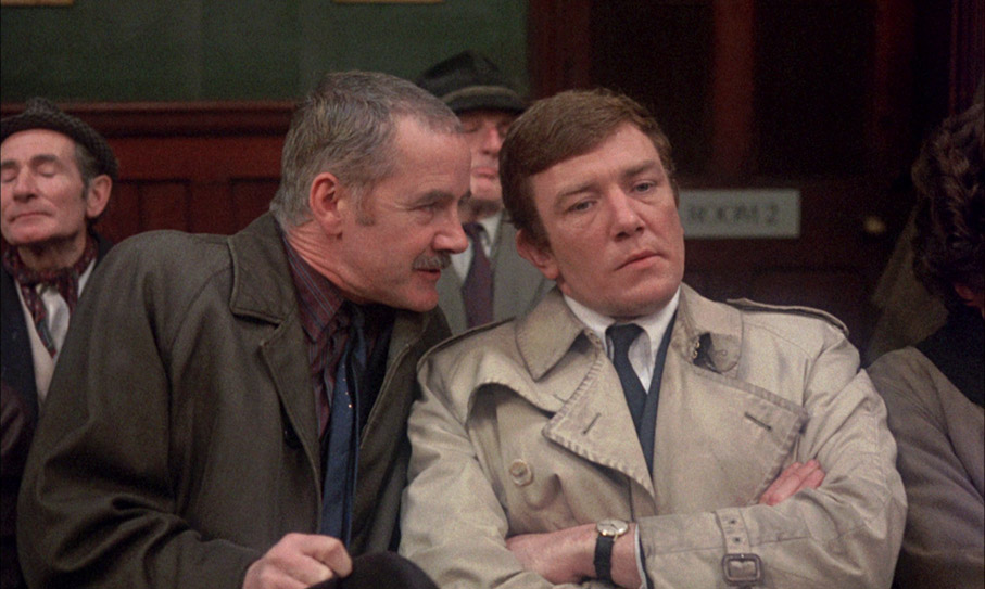 Straker (Fulton Mackay) leans on Ginley (Albert Finney)