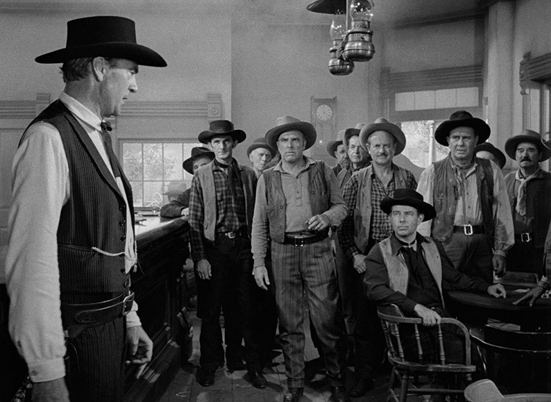 Kane attempts to recruits help at the saloon