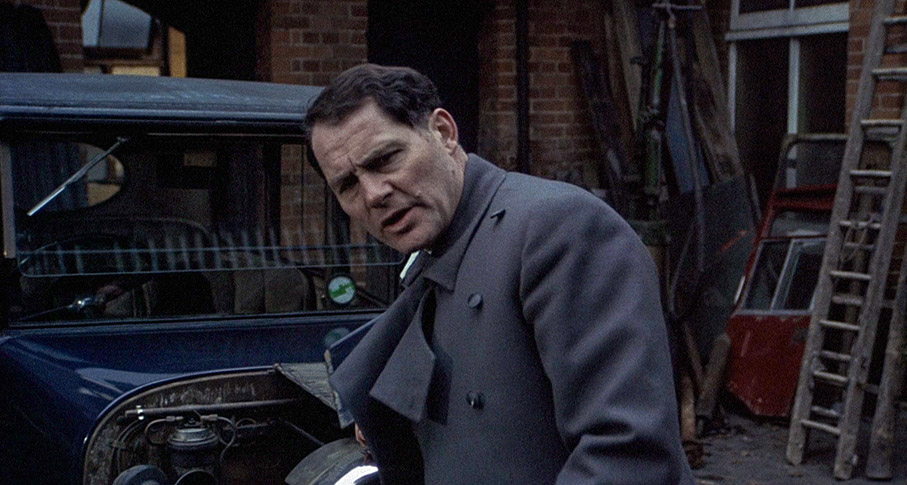 Robert Shaw as Steven preps to leave on a job