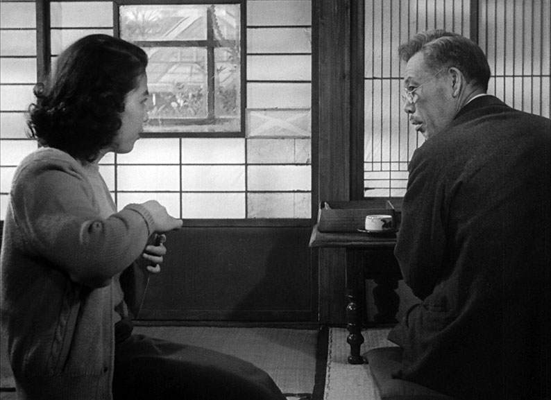 Kanji converses with his daughter-in-law Kazue