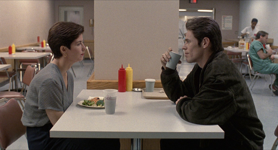 Marianne and John reconcile in a hospital canteen