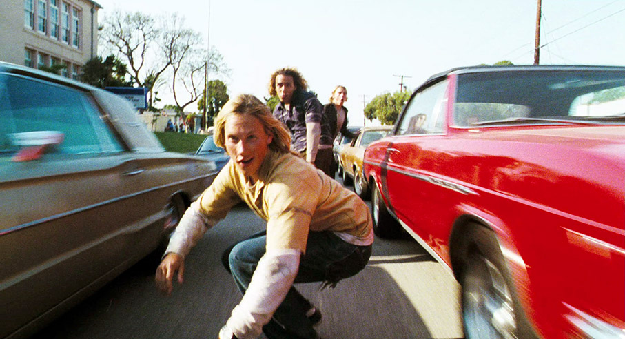 Stacy, Tony and Jay glide between cars