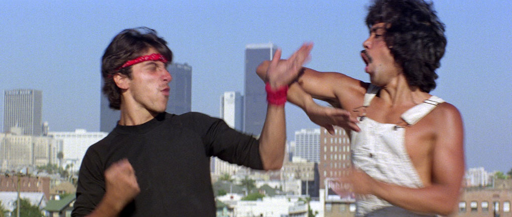 Bill Louie (right) fights an unidentified local in a showcase rooftop battle in The Old Master