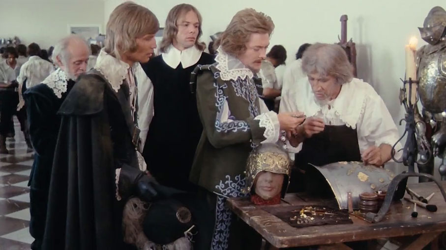 d'Artagnan watches on as The Duke of Buckingham asks his jewller O'Reilly (played by a disguised Frank Finlay)