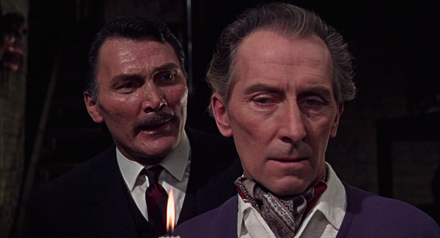 Jack Palance as Wyatt and Peter Cushing as Canning in The Man Who Collected Poe