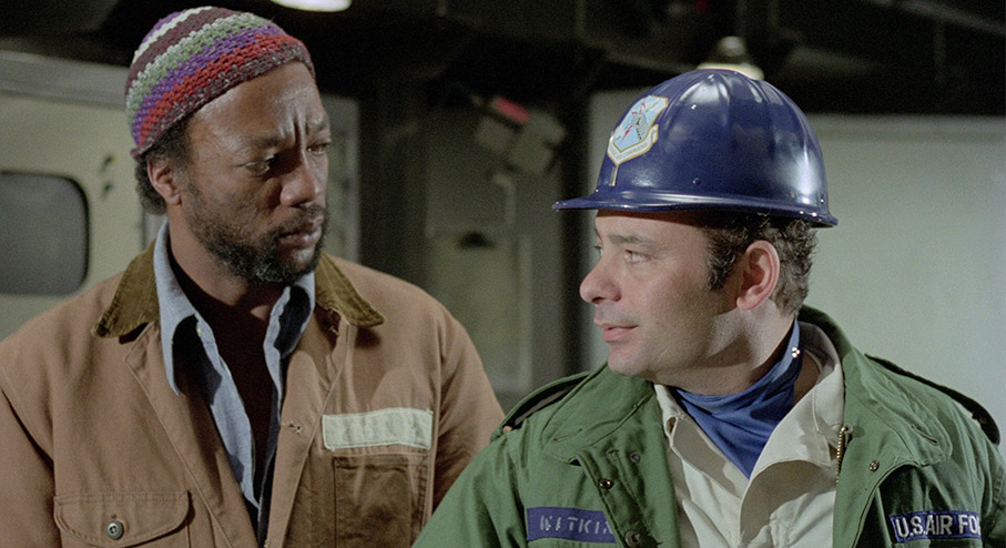 Paul Winfield and Burt Young as Willis Powell and Augie Garvas
