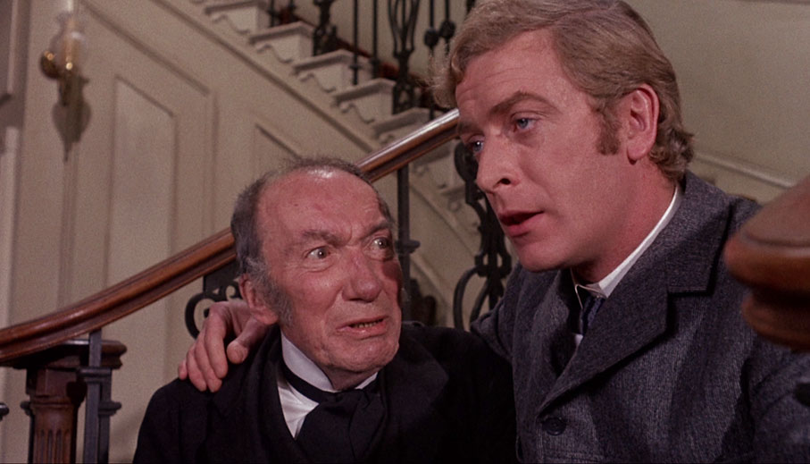 Wilfred Lawson as Peacock, with Michael Caine